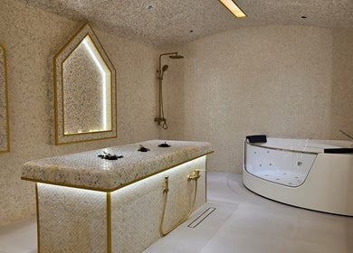 Luxurious spa room at By H Beauty Ladies Salon, Dubai, Dubai, AE, featuring a massage table and Jacuzzi.