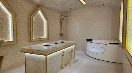Luxurious spa room at By H Beauty Ladies Salon, Dubai, Dubai, AE, featuring a massage table and Jacuzzi.