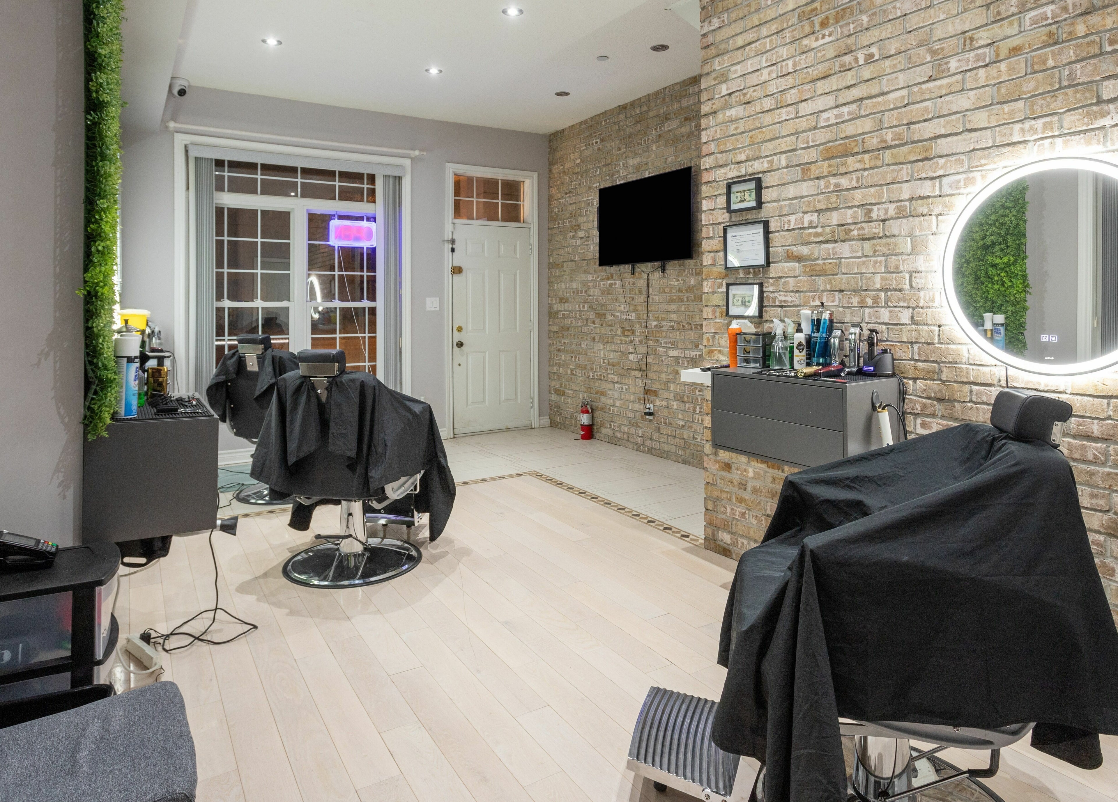 Elegant barber setup at KustomCuts in Toronto, Ontario, CA, featuring modern decor and ambient lighting.