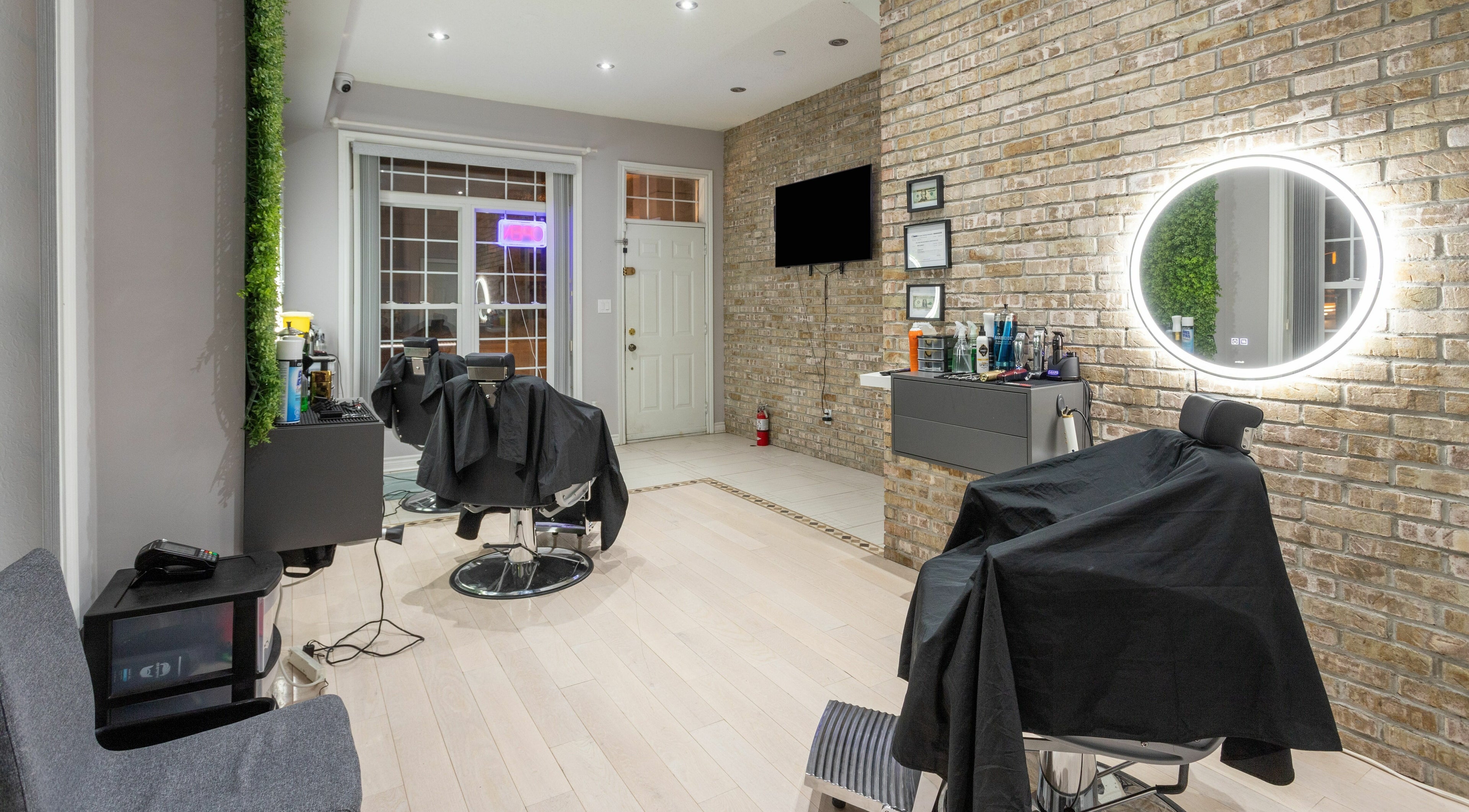 Elegant barber setup at KustomCuts in Toronto, Ontario, CA, featuring modern decor and ambient lighting.