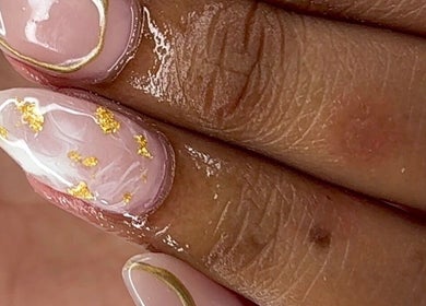 Elegant nail art with gold accents at RichOffNailsFL Nail Artistry in Orlando, Florida, US.