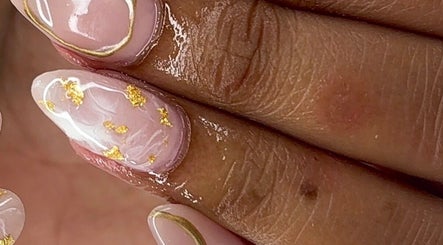 Elegant nail art with gold accents at RichOffNailsFL Nail Artistry in Orlando, Florida, US.