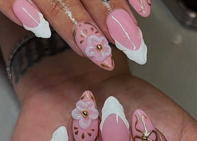 Elegant pink floral nail art from RichOffNailsFL Nail Artistry in Orlando, Florida, US showcasing intricate designs.