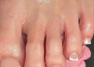 French pedicure at RichOffNailsFL Nail Artistry, Orlando, Florida, US, highlighting clean and polished toes.