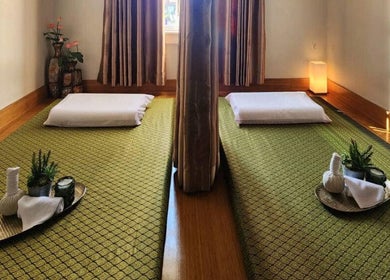 Serene massage room at Golden Fingers Thai Massage - Morningside, Auckland, NZ with traditional mats and decor.
