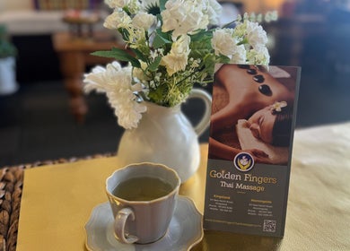 Relaxing ambiance at Golden Fingers Thai Massage - Morningside, Auckland, NZ with flowers and herbal tea.
