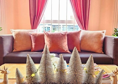 Elegant lounge at Golden Fingers Thai Massage - Kingsland, Auckland, Auckland, NZ with comfy couch and decor.