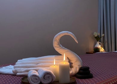 Elegant massage setup at Golden Fingers Thai Massage - Kingsland, Auckland, Auckland, NZ with candles and towels.