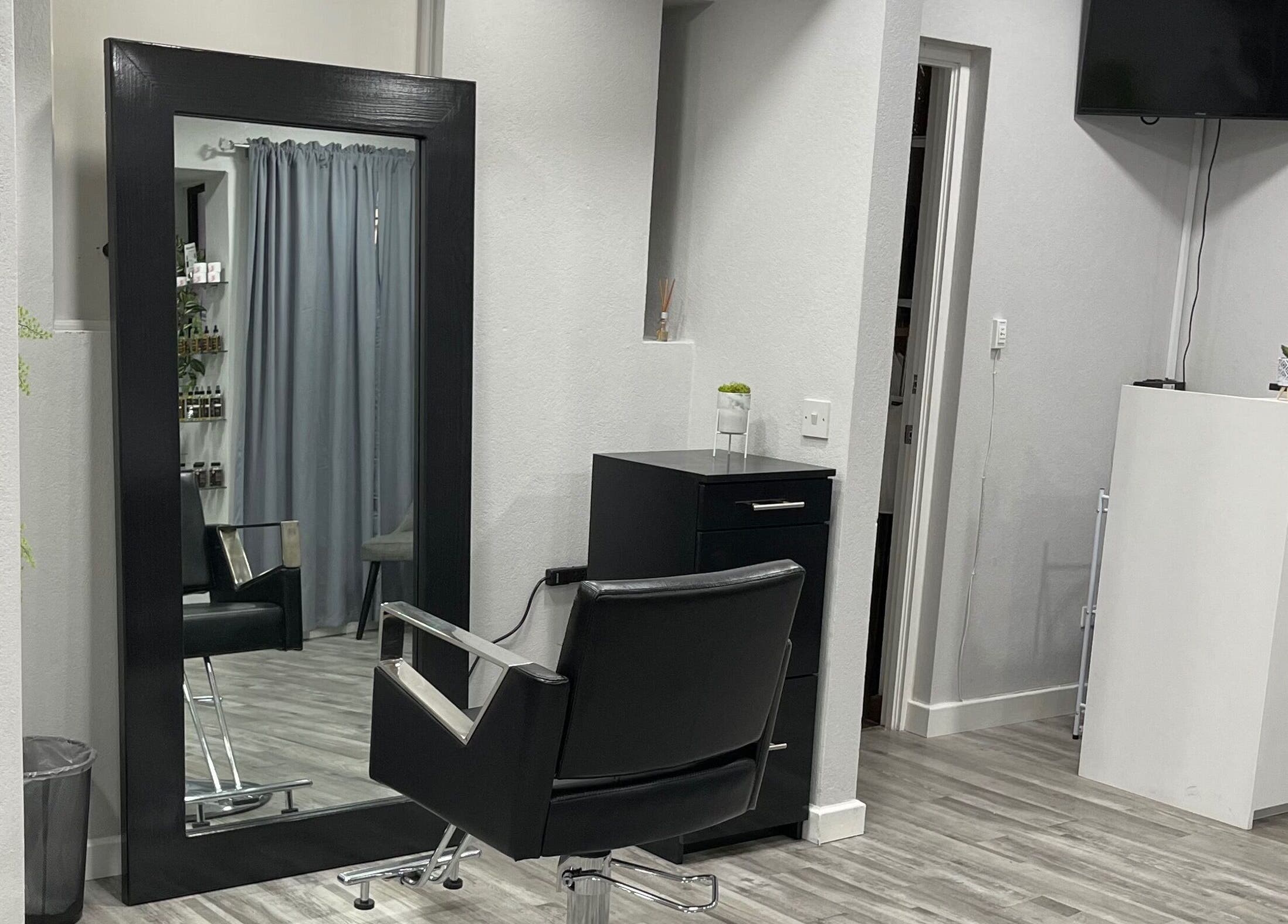 Modern salon chair and mirror at Image by Sha-Nae, Bridgetown, Saint Michael, BB. Sleek decor for a stylish experience.