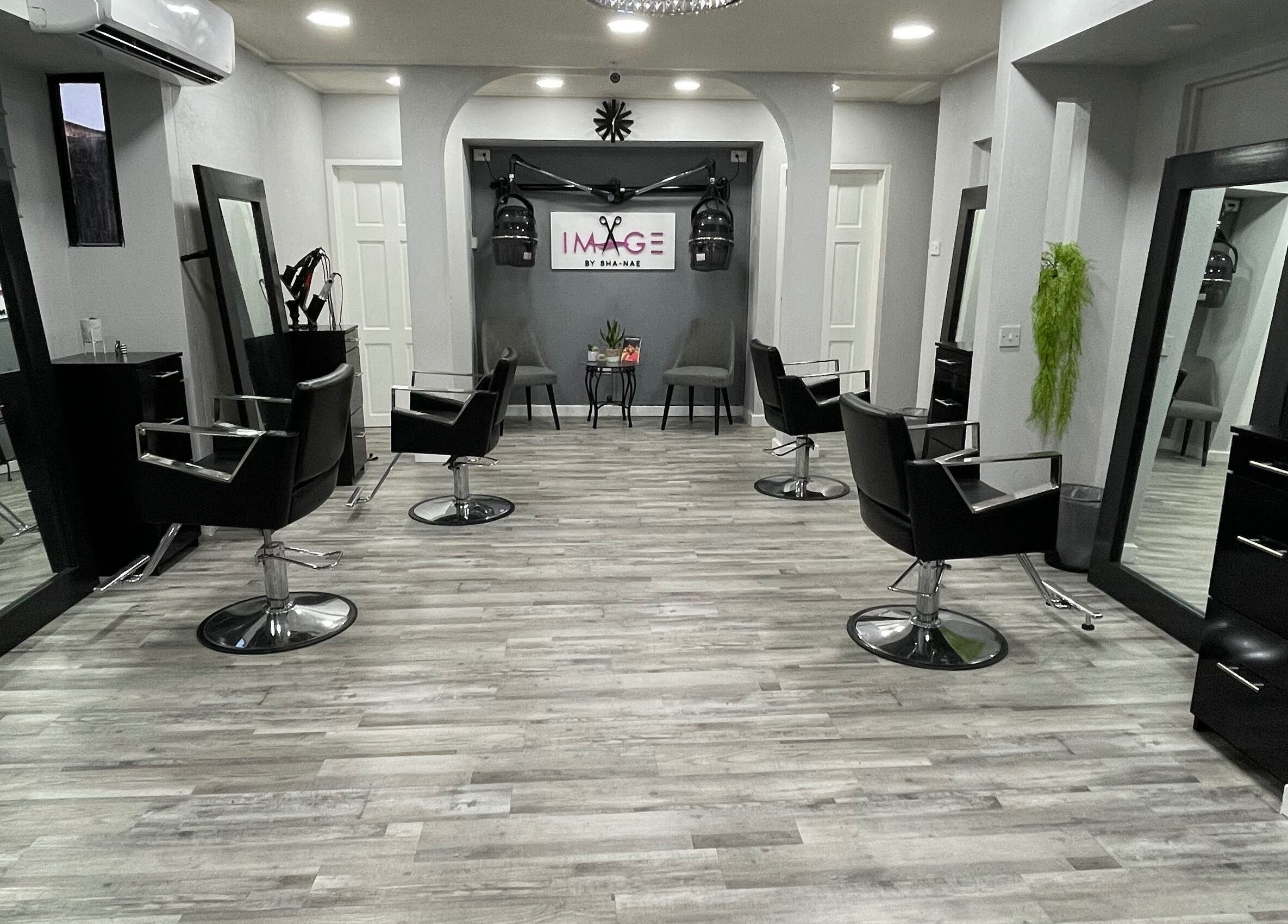 Modern salon interior at Image by Sha-Nae, Bridgetown, Saint Michael, BB with stylish black chairs and mirrors.