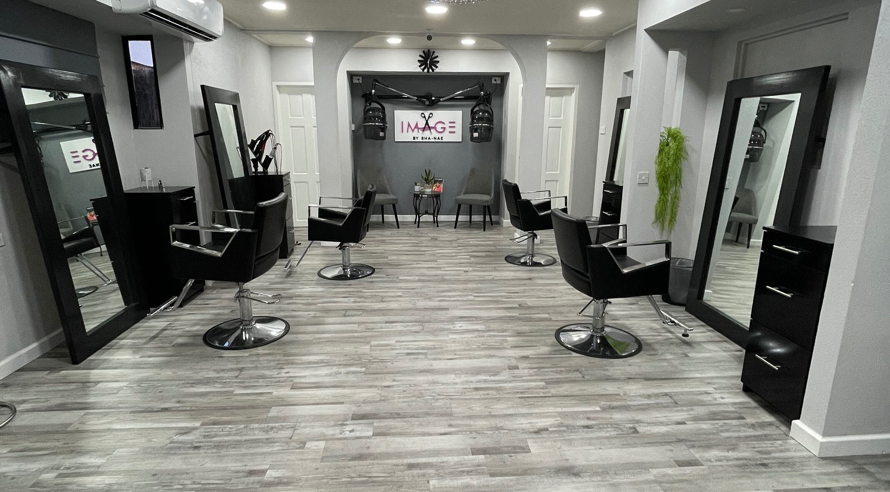 Modern salon interior at Image by Sha-Nae, Bridgetown, Saint Michael, BB with stylish black chairs and mirrors.