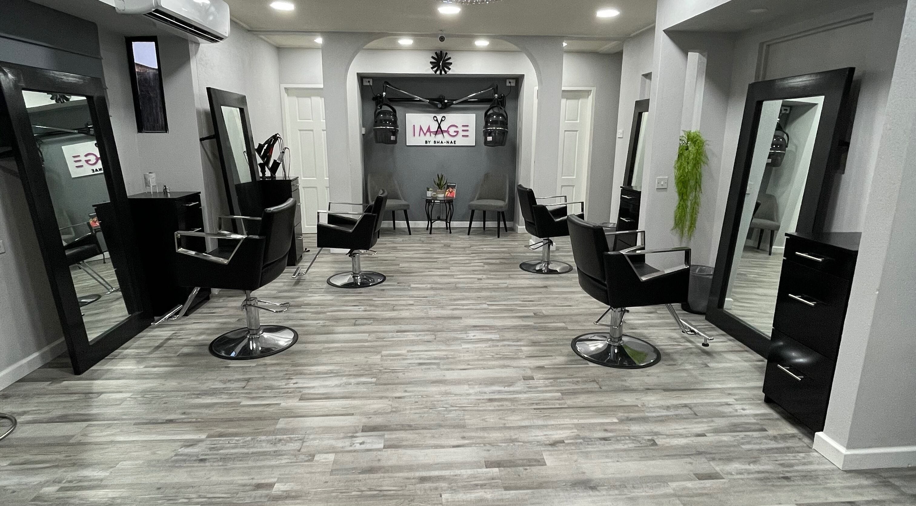 Modern salon interior at Image by Sha-Nae, Bridgetown, Saint Michael, BB with stylish black chairs and mirrors.