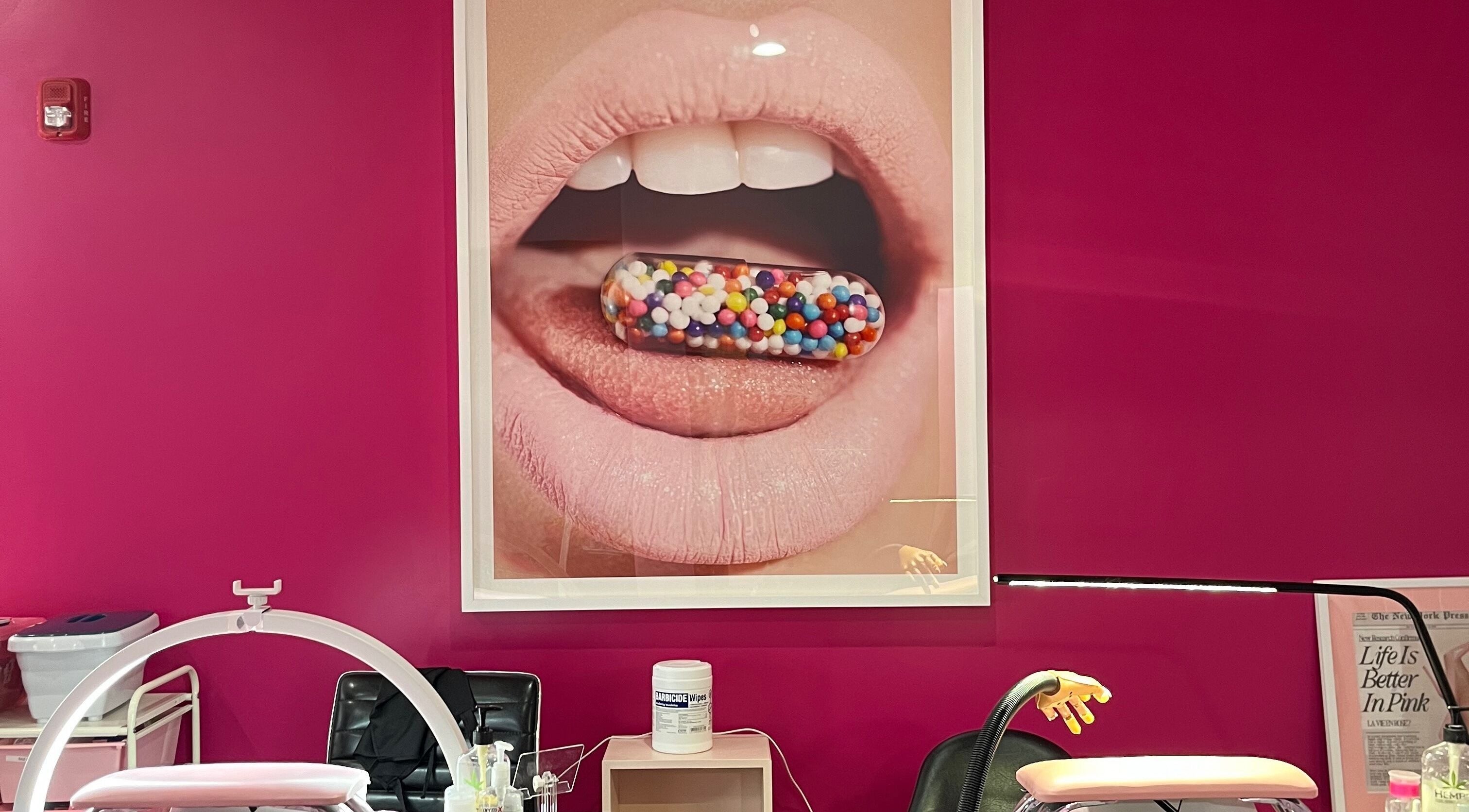 Interior of Pinkies Beauty Bar in Pleasant Grove, Utah, US featuring bold pink decor and modern equipment.