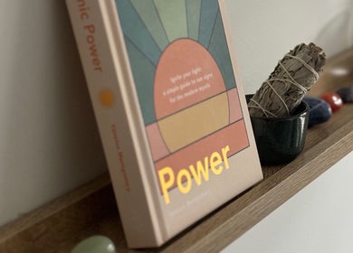 Book and sage on a wooden shelf at Lullaby Wellness, Hamlyn Terrace, New South Wales, AU promote relaxation.