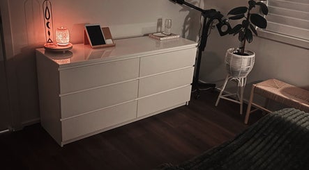 Cozy corner at Lullaby Wellness in Hamlyn Terrace, New South Wales, AU with calming decor and ambient lighting.