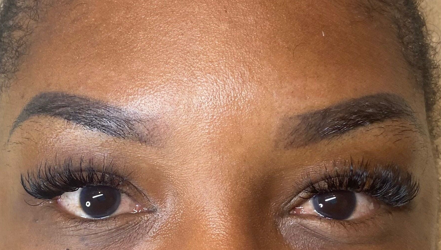 Close-up of professionally styled lashes at Lashes By L’hé, Marigot, MF.