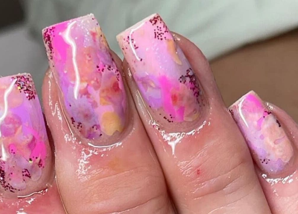 Vivid pink and purple nail art at Klass, Swinton, England, GB, showcasing intricate design.