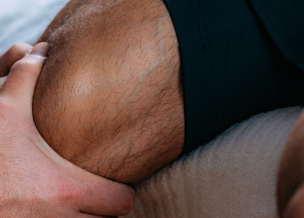 Hand applying massage therapy on knee at Bodyspace Recovery Studio, Jandakot, Western Australia, AU.