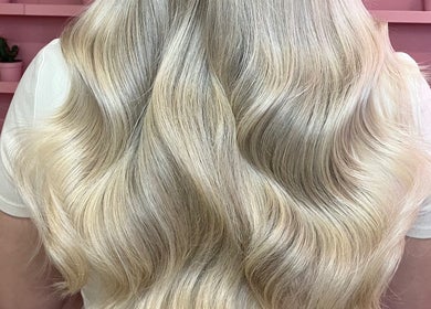Blonde wavy hair styled at JessicaLibbyHair in Hinckley, England, GB.