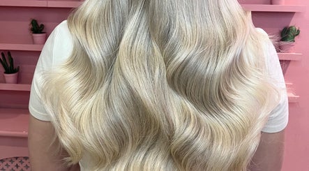 Blonde wavy hair styled at JessicaLibbyHair in Hinckley, England, GB.