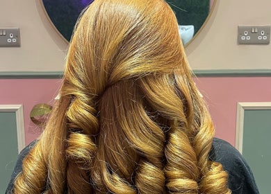 Beautiful curled hairstyle at JessicaLibbyHair, Hinckley, England, GB, showcasing expert styling and vibrancy.