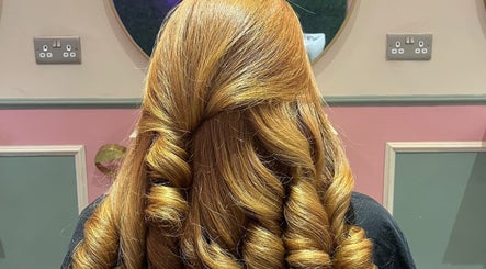 Beautiful curled hairstyle at JessicaLibbyHair, Hinckley, England, GB, showcasing expert styling and vibrancy.