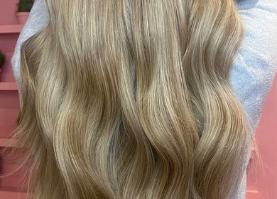 Flowing blonde hair at JessicaLibbyHair in Hinckley, England, GB, showcasing expert styling and vibrant color.
