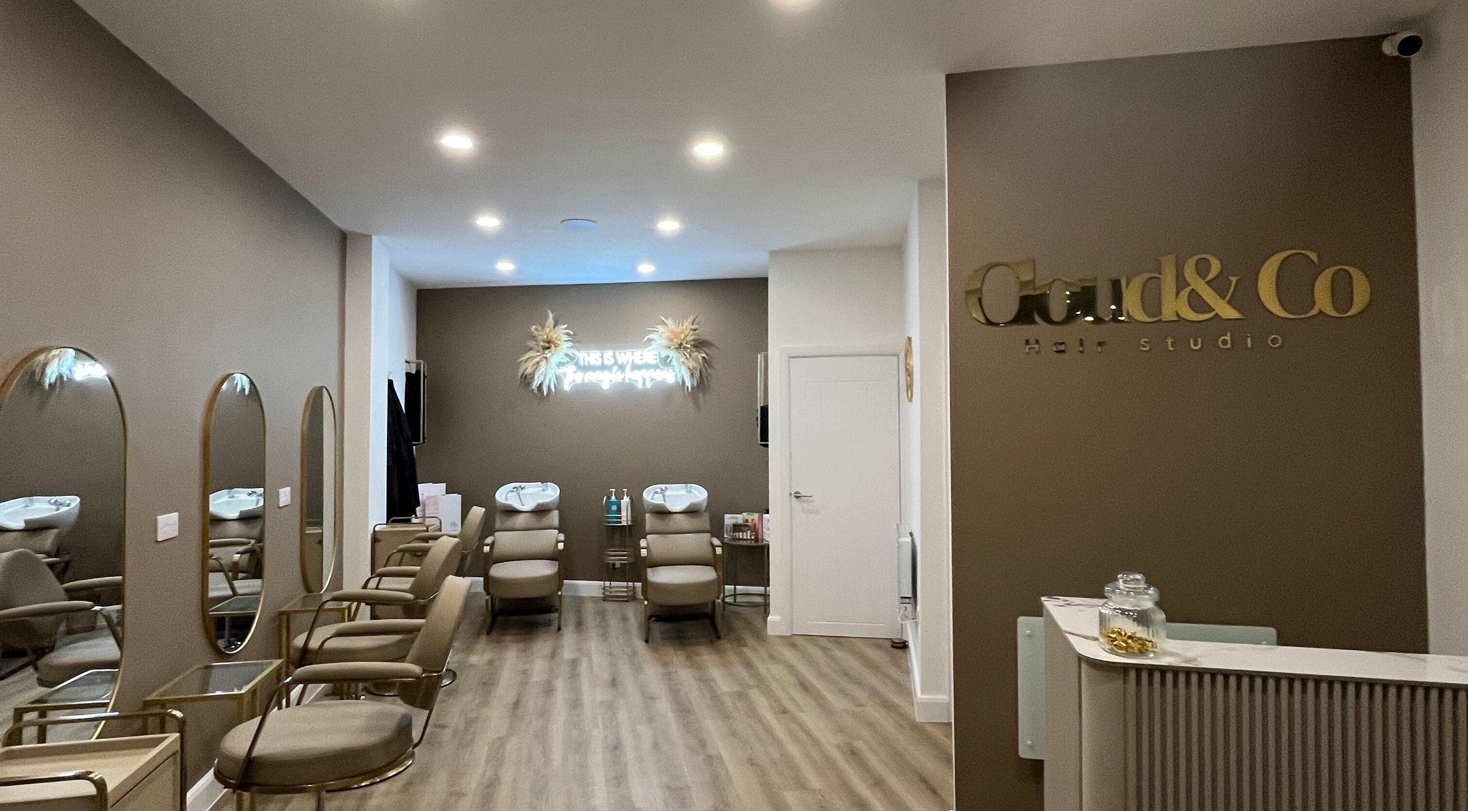 Interior of JessicaLibbyHair salon in Hinckley, England. Stylish chairs and mirrors create a modern, welcoming atmosphere.