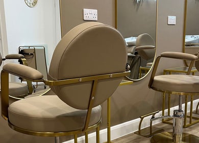 Modern salon chairs with mirrors at JessicaLibbyHair, Hinckley, England, GB, create a luxurious atmosphere.