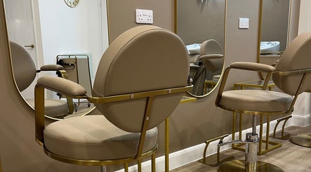 Modern salon chairs with mirrors at JessicaLibbyHair, Hinckley, England, GB, create a luxurious atmosphere.