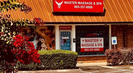 Front entrance of Master Massage and Spa in Knoxville, Tennessee, US, showcasing vibrant signage and inviting decor.