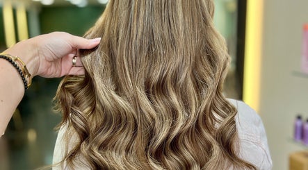 Luxurious wavy hair styled at Aura Extensions, Twickenham, England, GB.