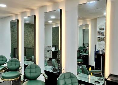 Elegant salon chairs and mirrors at Aura Extensions, Twickenham, England, GB designed for luxury service.