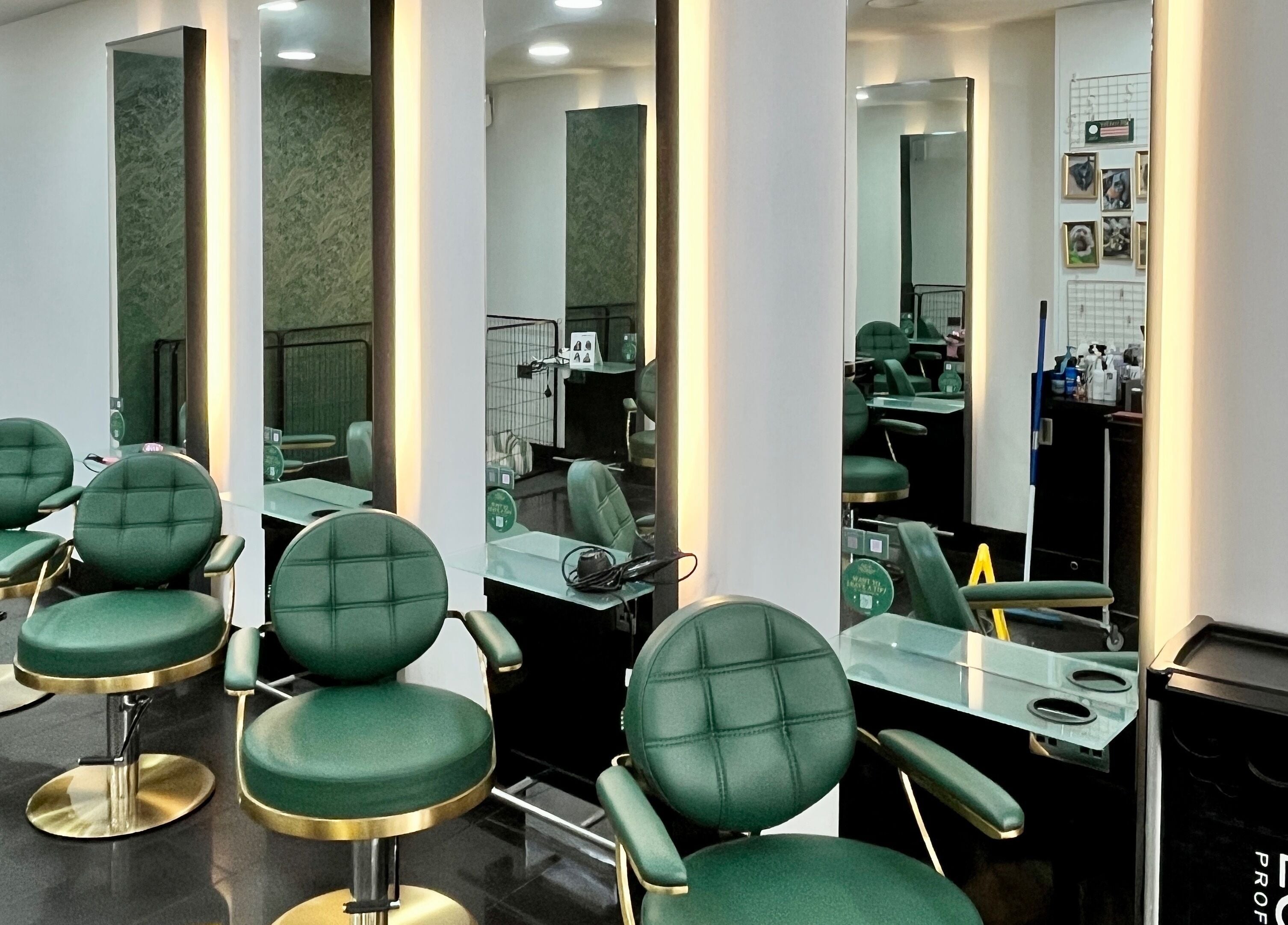 Elegant salon chairs at Aura Extensions in Twickenham, England, GB, reflecting modern beauty space design.