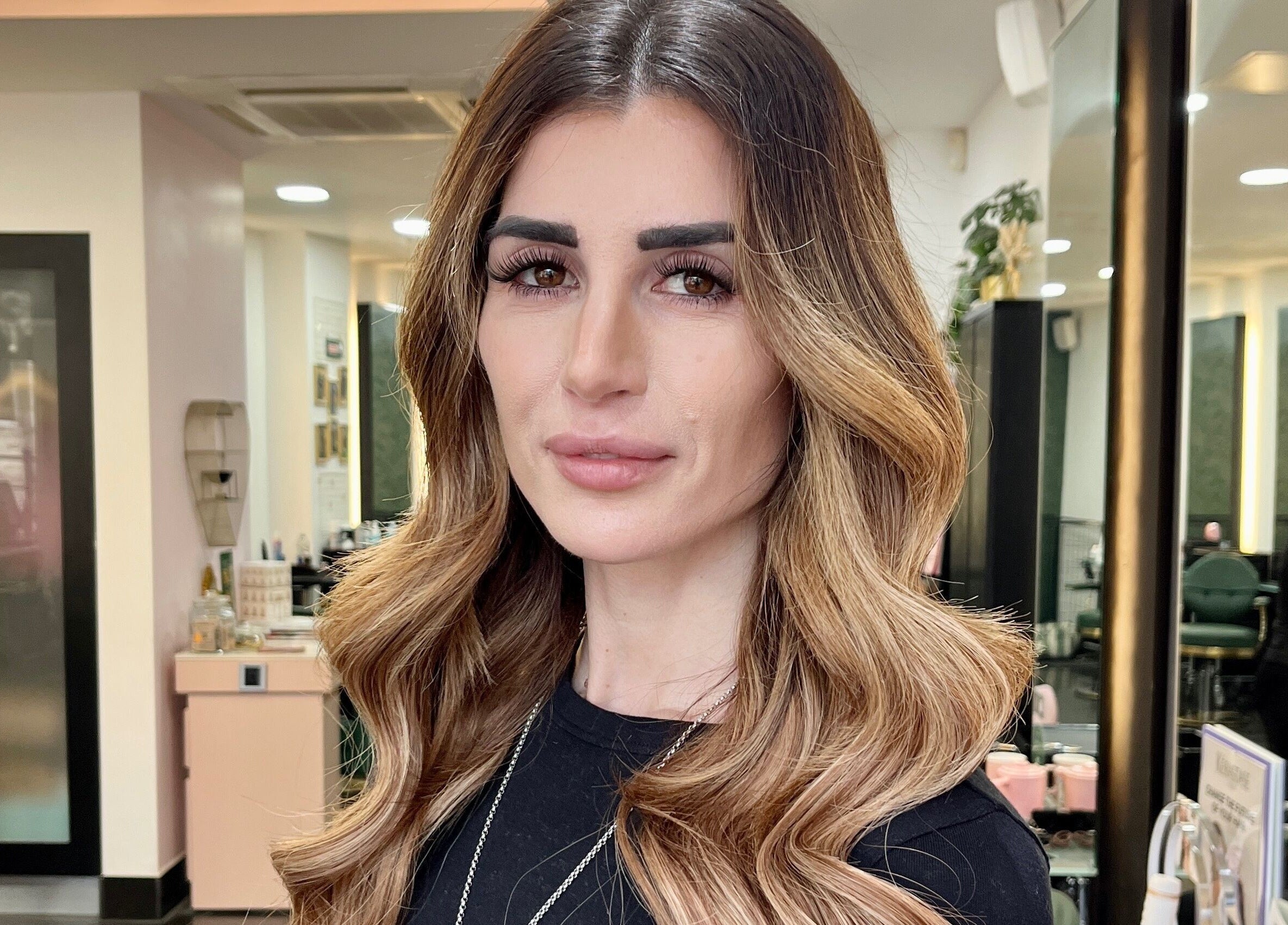 Elegant hairstyle at Aura Extensions in Twickenham, England, GB, showcasing sophisticated curls.