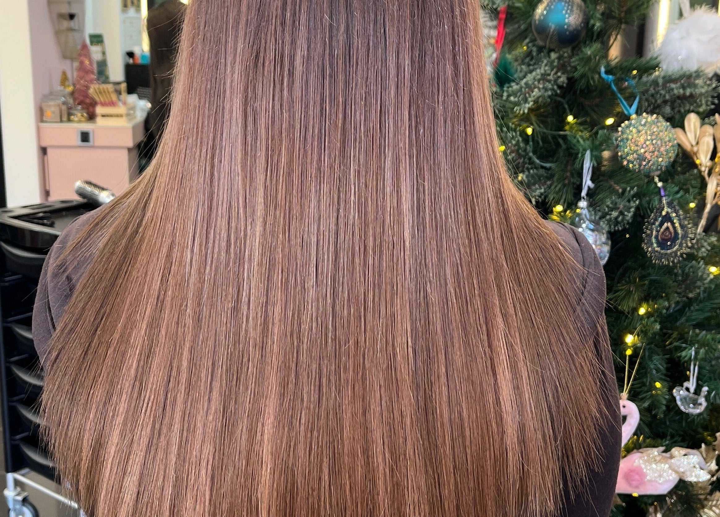 Sleek, smooth hair showcasing transformation at Aura Extensions in Twickenham, England, GB.