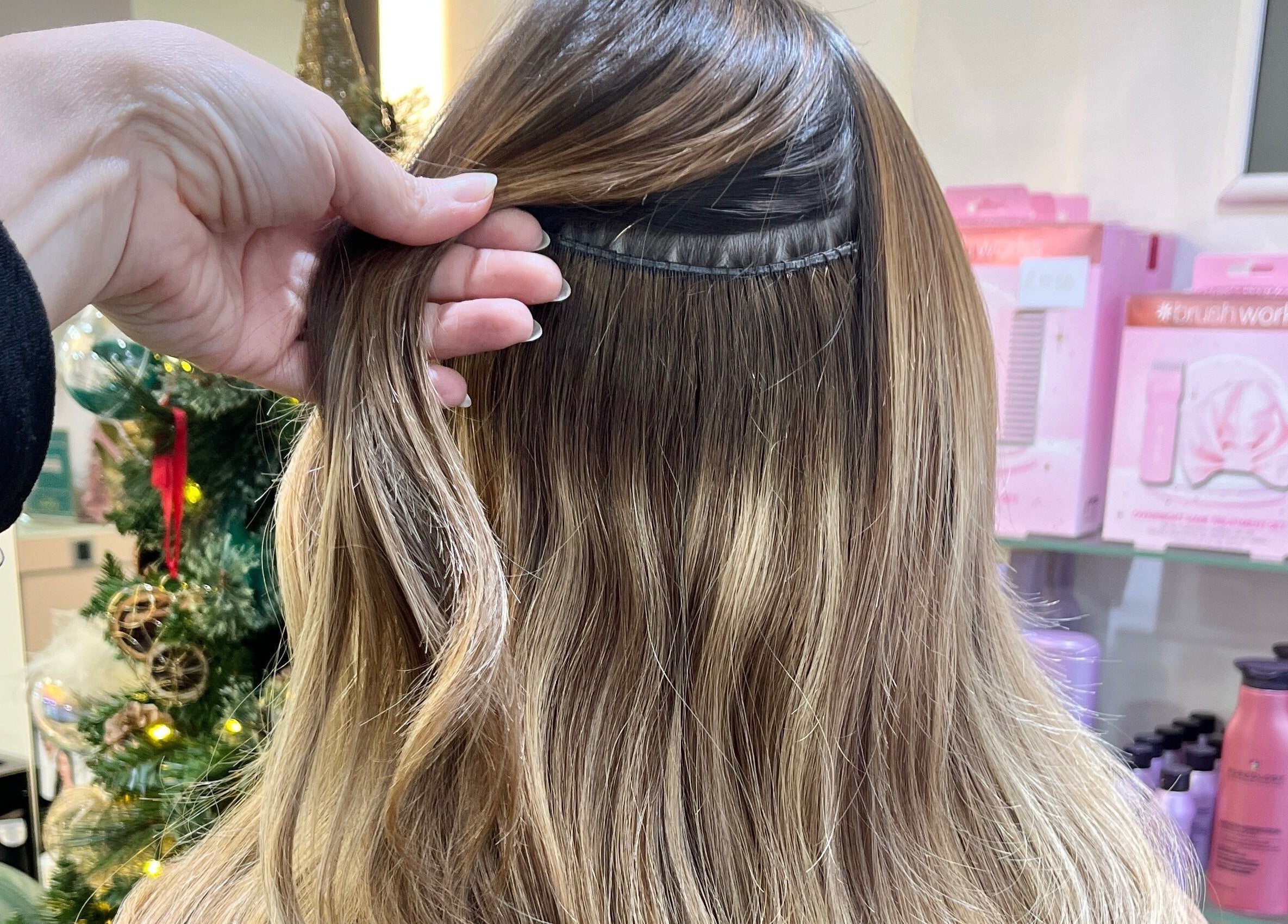 Hair extensions at Aura Extensions, Twickenham, England, GB showcasing premium quality and seamless blend.