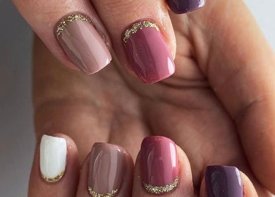 Chic nail design with gold accents at ClassicTouch beauty in Dublin, Blackrock, County Dublin, IE.