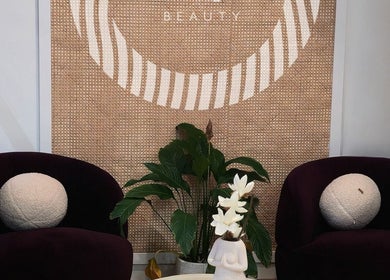 Stylish waiting area at Olimpia, ROSEBERY, New South Wales, AU with chic decor and plant details.