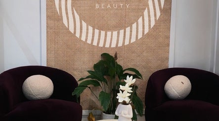Stylish waiting area at Olimpia, ROSEBERY, New South Wales, AU with chic decor and plant details.