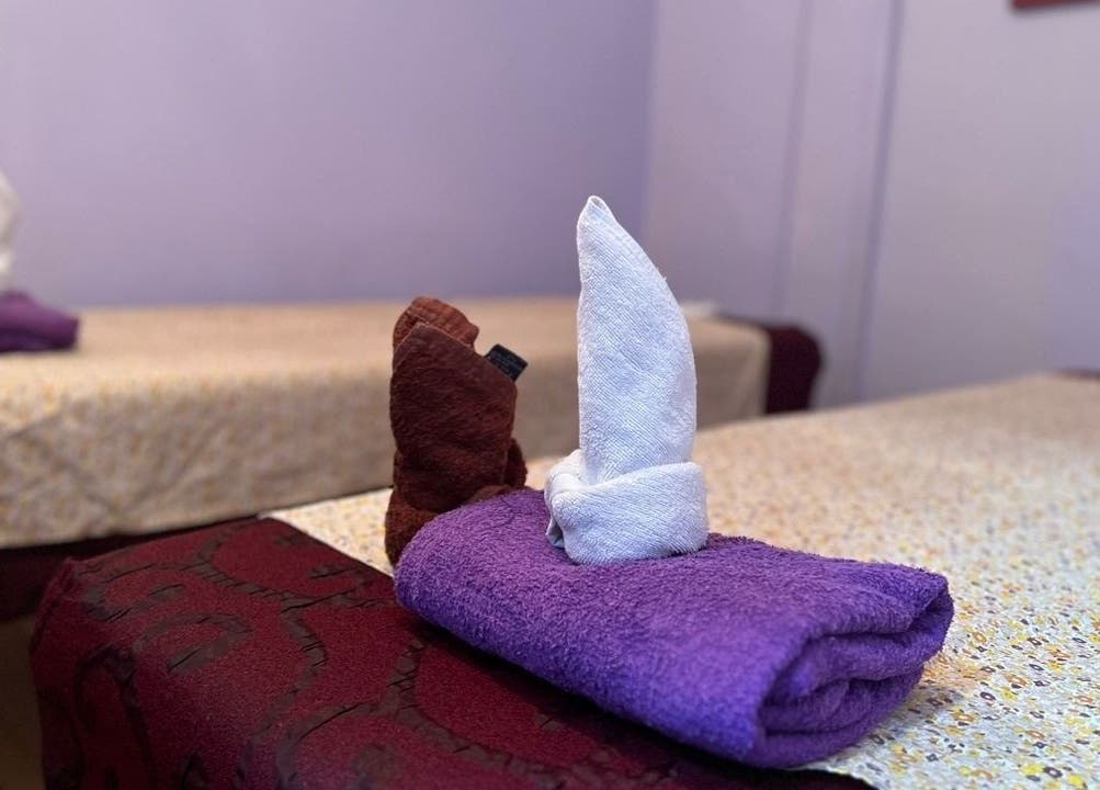 Cozy massage tables with folded towels at Ventus Spa 沙巴亚庇正宗精油按摩会所, Kota Kinabalu, Sabah, MY.