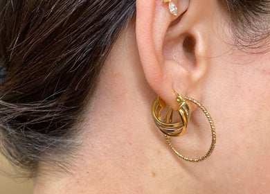 Close-up of gold hoop earrings worn at Dalia Aziz Aesthetics, Verdun, Beirut Governorate, LB.