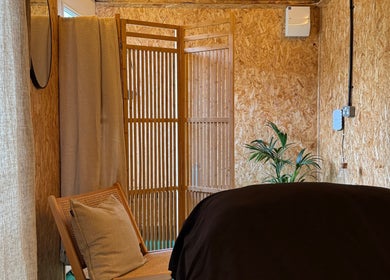 Cozy massage room at Massage Margate with soft lighting and wood decor, located in Margate, GB.