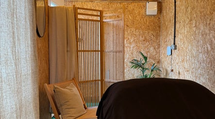 Cozy massage room at Massage Margate with soft lighting and wood decor, located in Margate, GB.