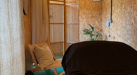 Cozy massage room at Massage Margate with soft lighting and natural decor in Margate, GB, offering serene relaxation.