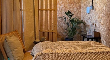 Cozy massage room at Massage Margate, Margate, GB with a comfortable chair and ambient decor.