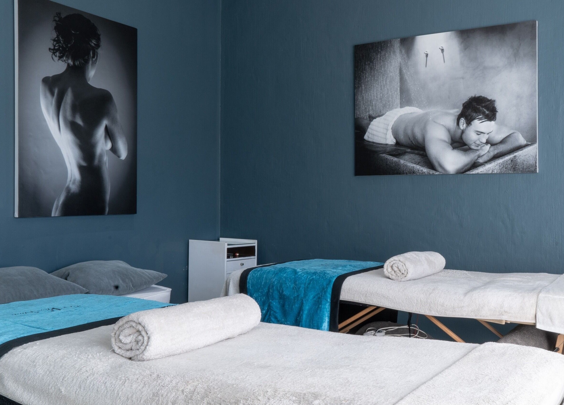 Massage tables in dimly lit room at Aqua Spa & Skin, Surf Village, Jeffreys Bay, Eastern Cape, ZA.