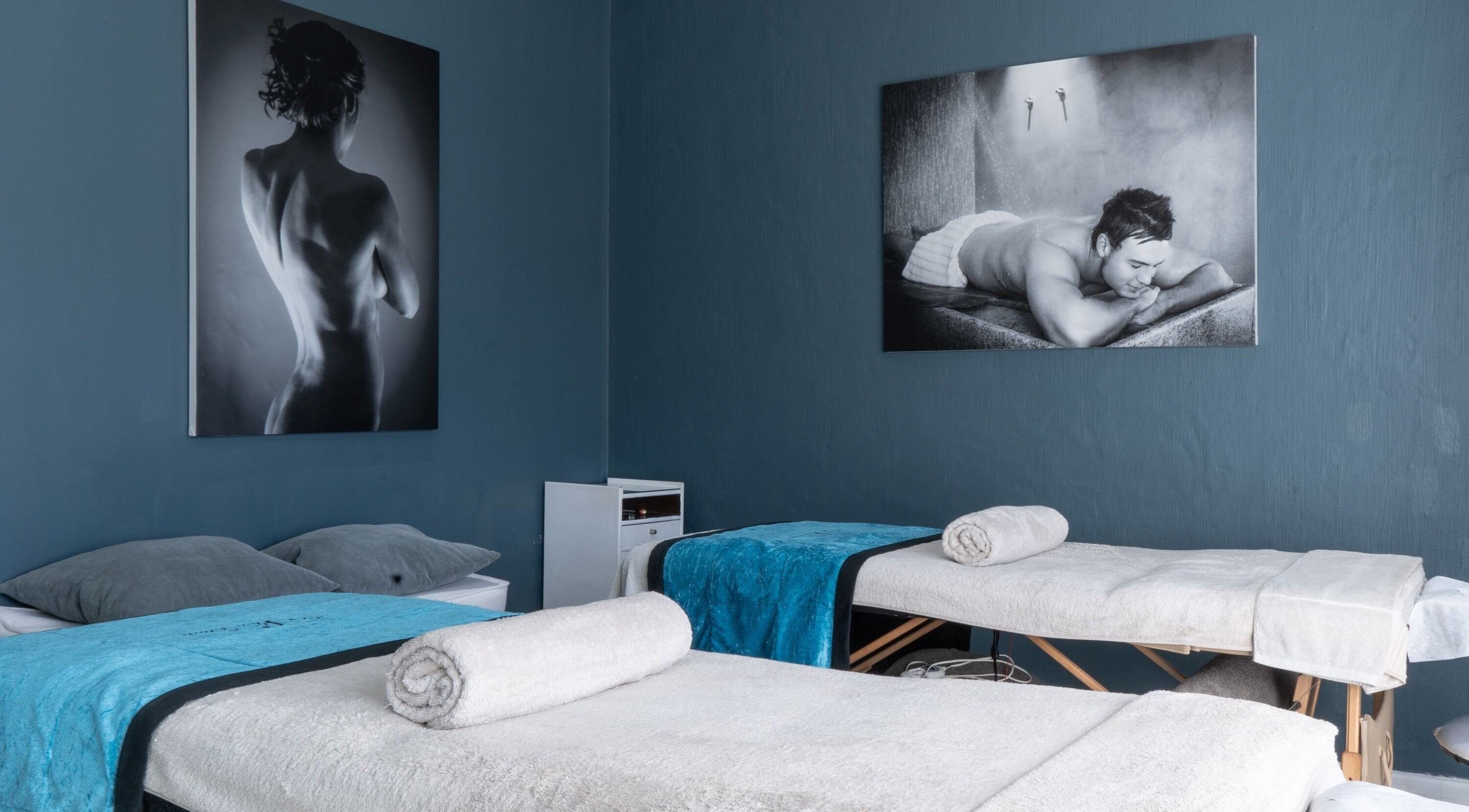 Massage tables in dimly lit room at Aqua Spa & Skin, Surf Village, Jeffreys Bay, Eastern Cape, ZA.