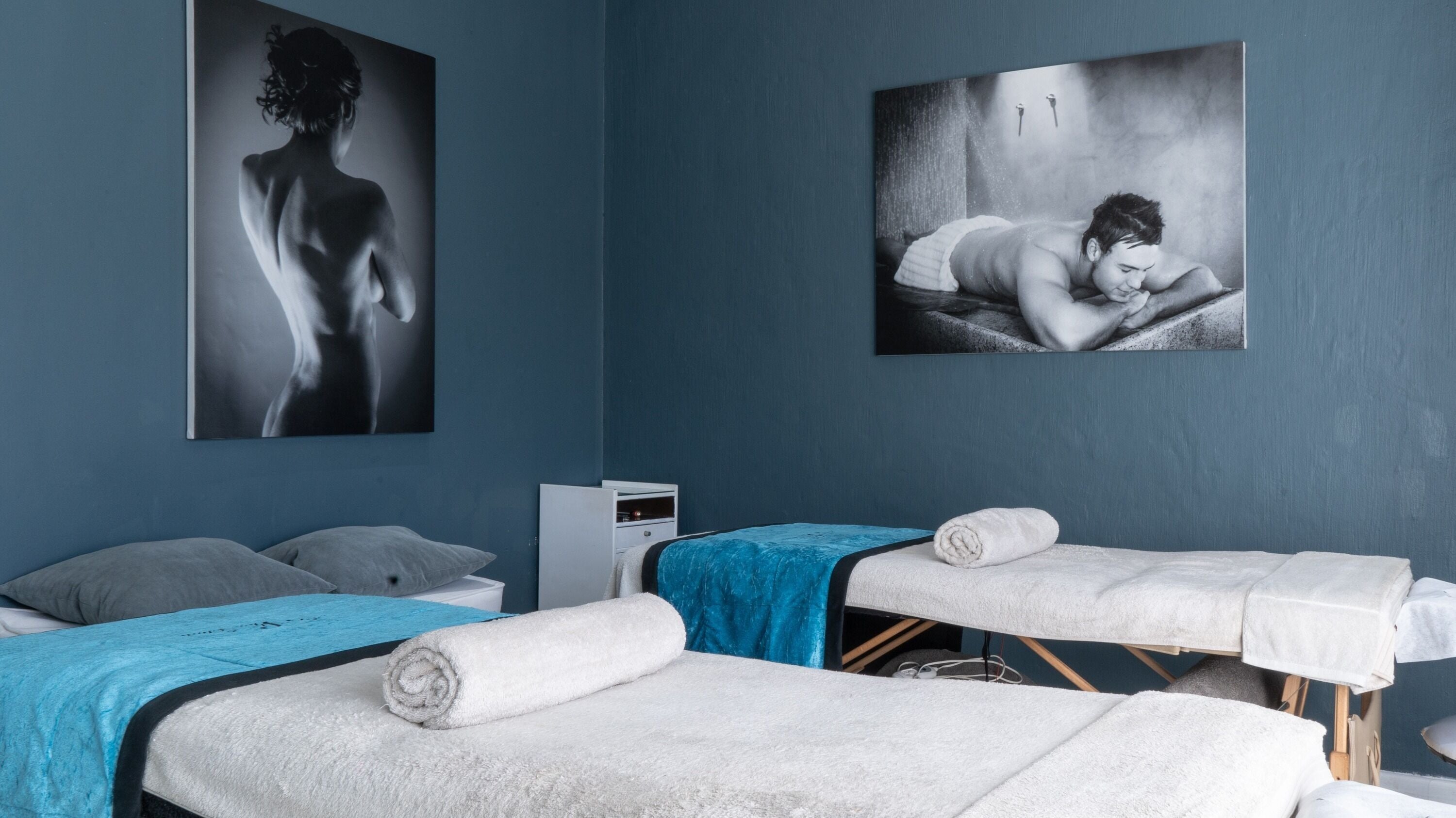 Massage tables in dimly lit room at Aqua Spa & Skin, Surf Village, Jeffreys Bay, Eastern Cape, ZA.