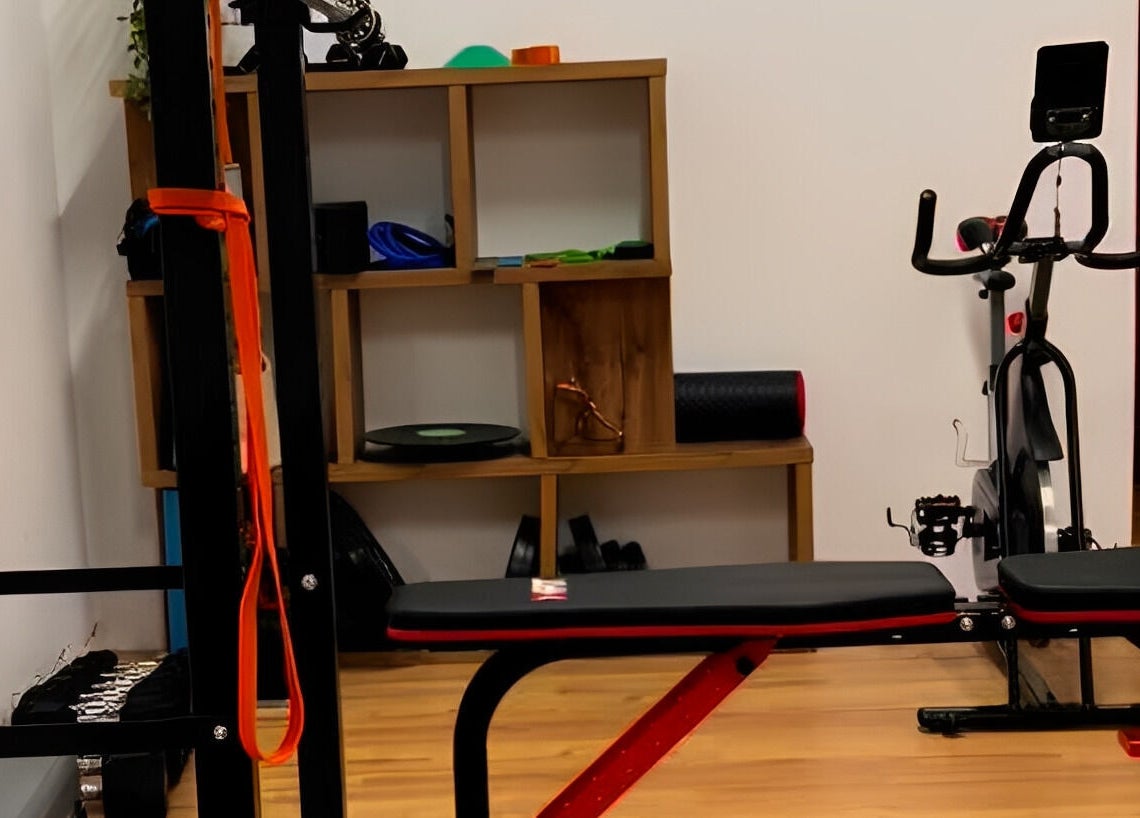 Theramotion Physiotherapy gym setup in Λευκωσία, Λευκωσία, CY with bench, bike, and equipment.